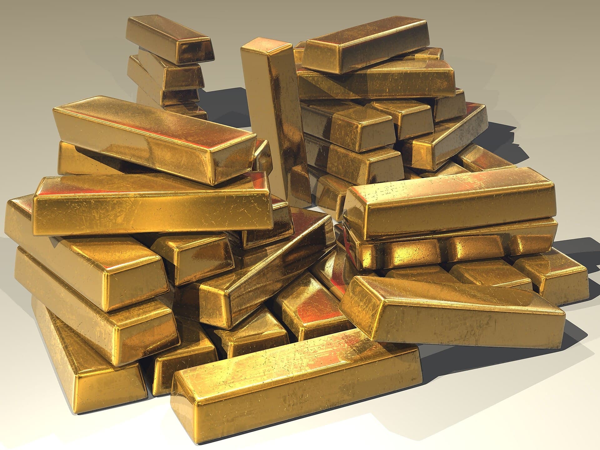 A pile of stacked gold bars representing the one-time founding fee